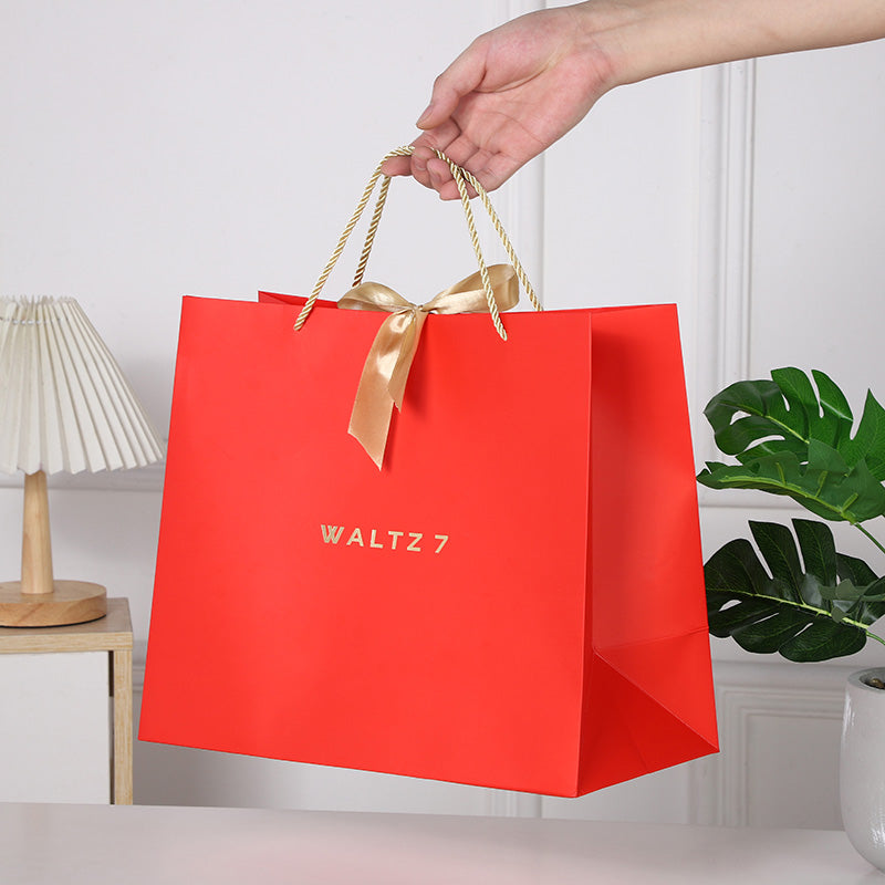 Geschenktasche mit Goldschleife