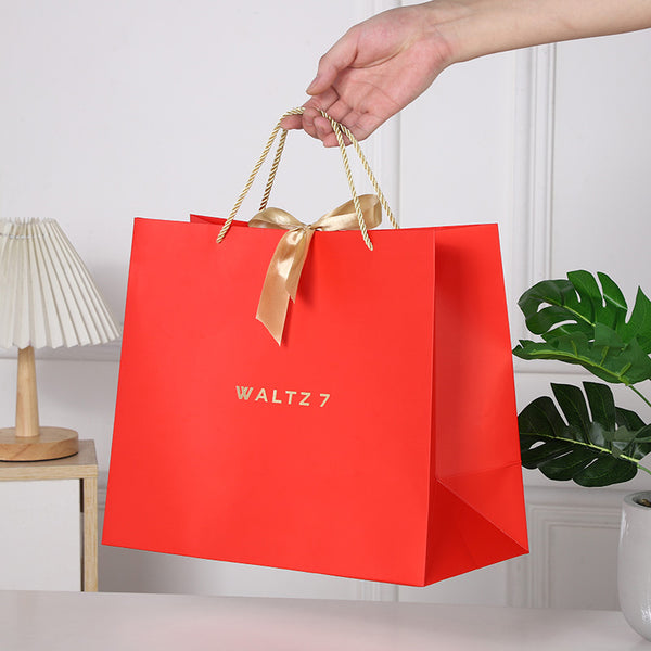 Geschenktasche mit Goldschleife