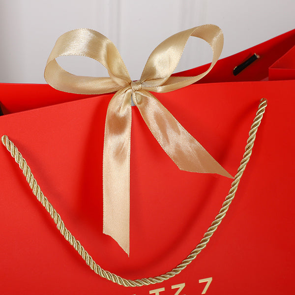 Geschenktasche mit Goldschleife