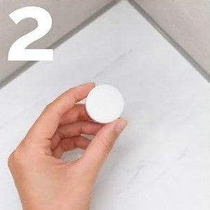 Placing the shower bomb in the shower